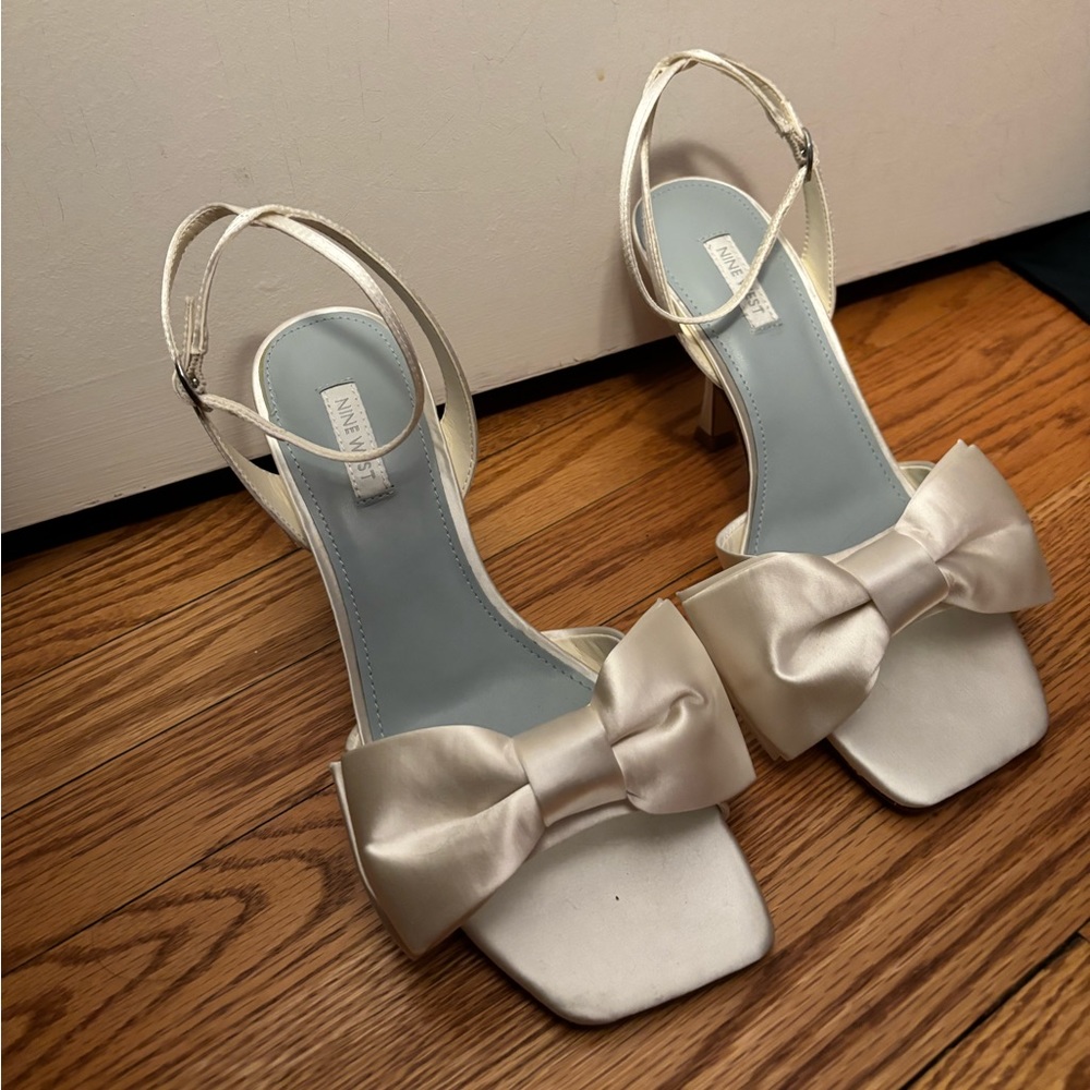 Never worn off white satin heels